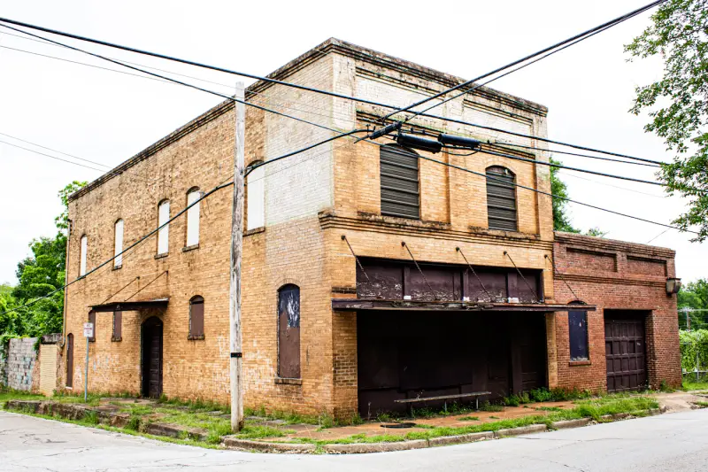 Two-storey brick commercial building on a small-town street corner