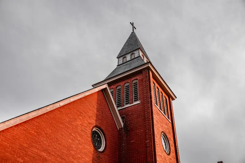 Red brick church with a bell tower