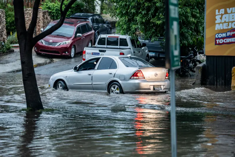 Cars stranded on a flooded street after a storm