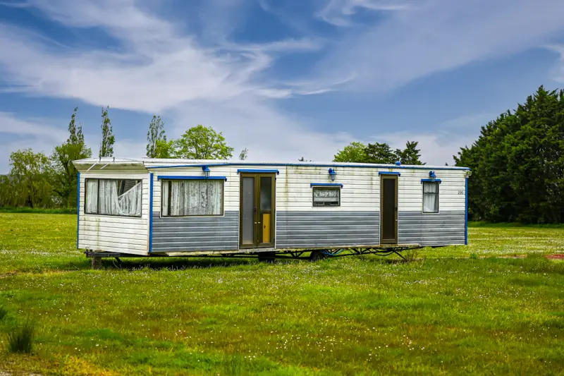 Manufactured home on a grassy acreage lot