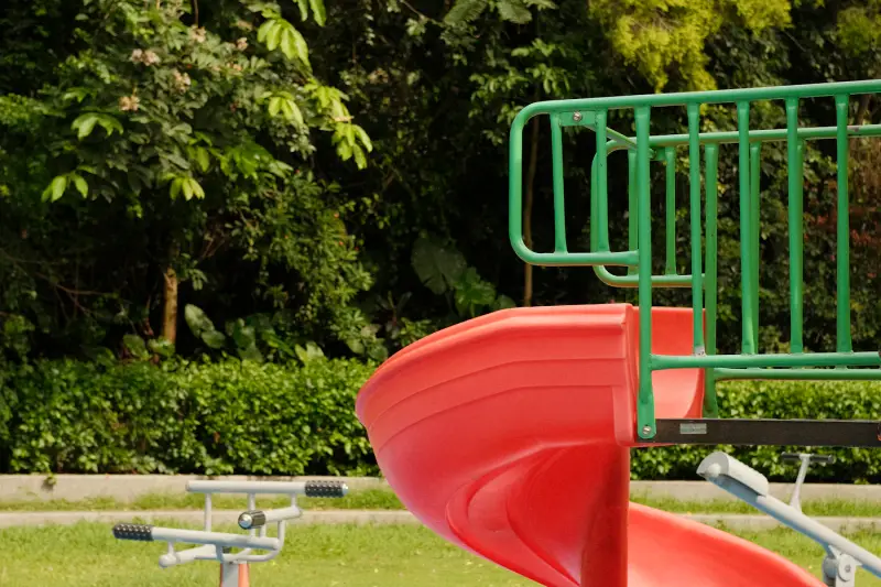 Playground slide in a shaded city park
